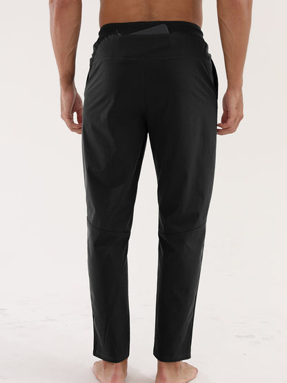 Men’s Thin Sports &amp; Leisure Running Pants worn by a man, showcasing the back view design and fit.