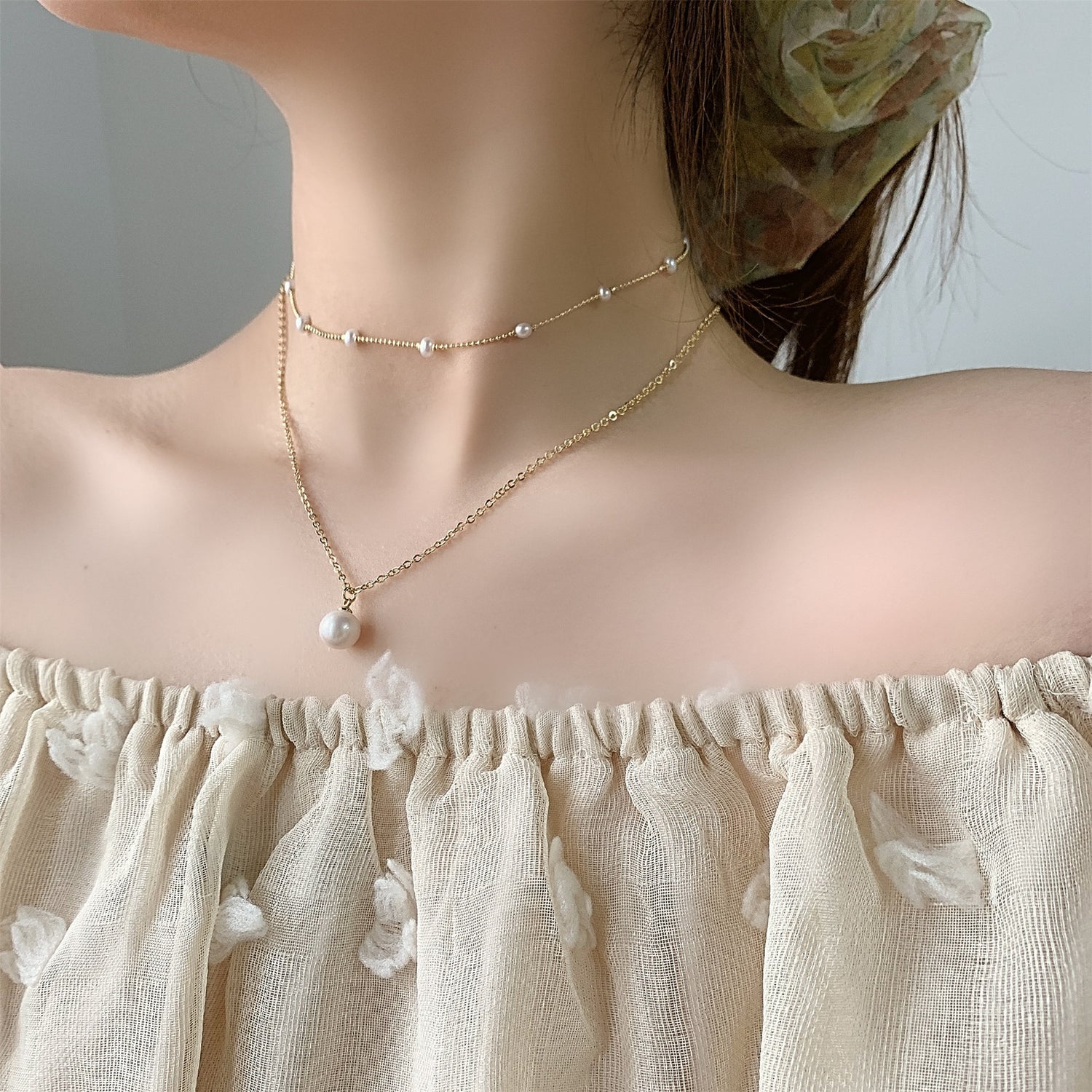 Multi-layered butterfly pearl necklace