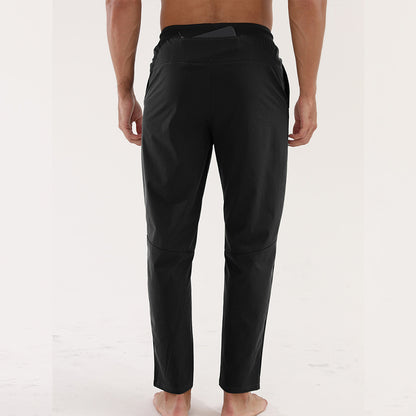 Men’s Thin Sports &amp; Leisure Running Pants showing the back view of a man wearing breathable fitness trousers.