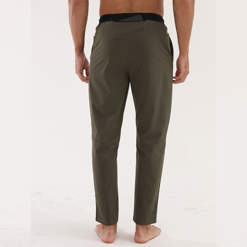 Men’s Thin Sports &amp; Leisure Running Pants view from the back in breathable fabric for fitness activities.
